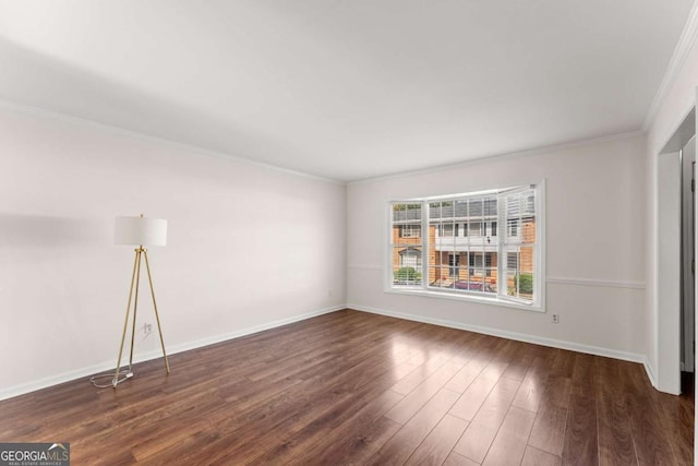 unfurnished room with crown molding and dark wood-type flooring