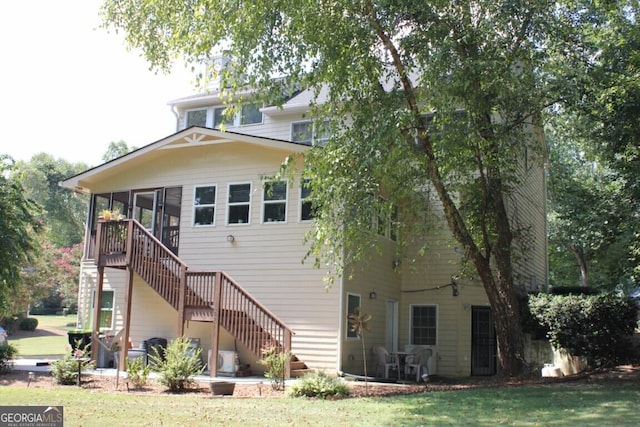 rear view of house with a lawn