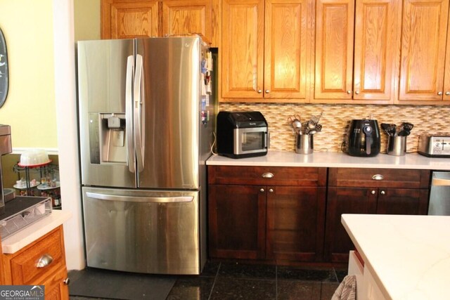 kitchen featuring tasteful backsplash and stainless steel appliances