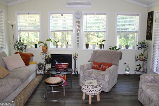 sunroom featuring a wall mounted AC, a healthy amount of sunlight, and lofted ceiling