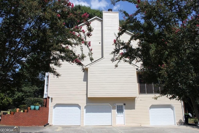 view of side of home featuring a garage