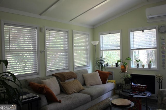 living room with a wall mounted air conditioner and vaulted ceiling