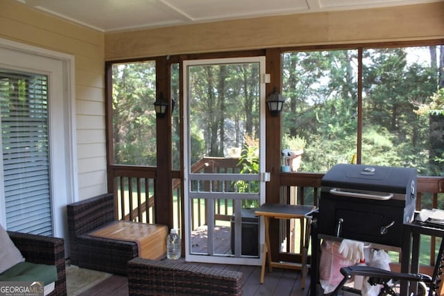 sunroom / solarium featuring a healthy amount of sunlight