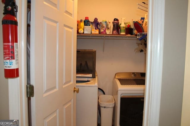 laundry room with separate washer and dryer