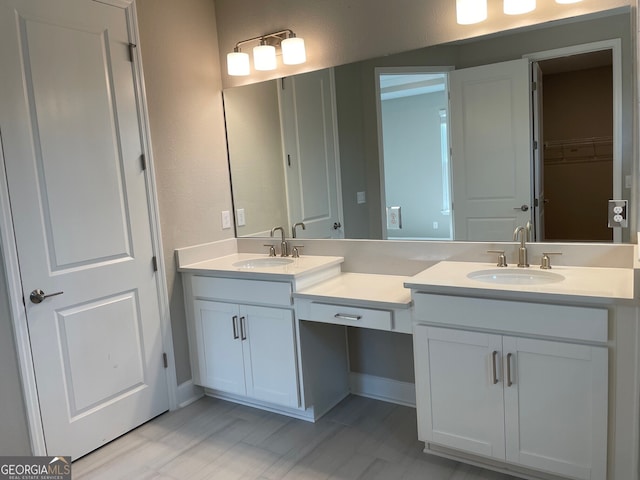 full bath with double vanity and a sink