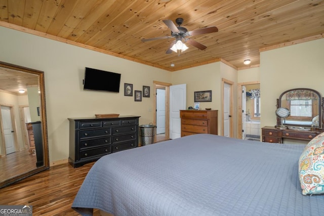 bedroom with ceiling fan, dark hardwood / wood-style floors, ornamental molding, connected bathroom, and wood ceiling