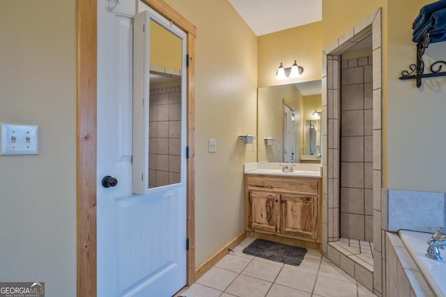 bathroom with vanity, tile patterned floors, and separate shower and tub