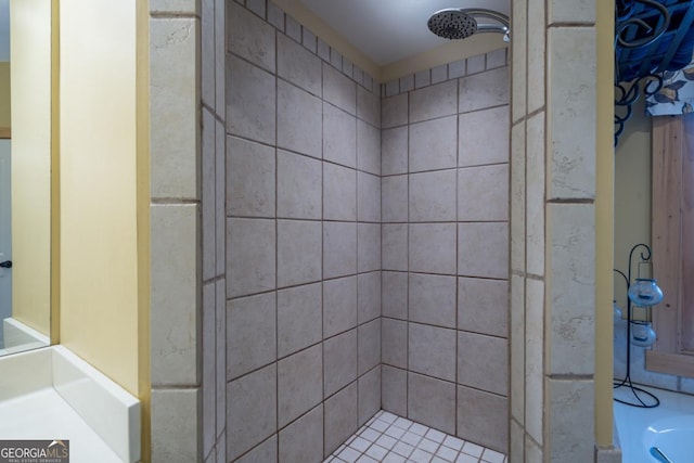 bathroom with tiled shower