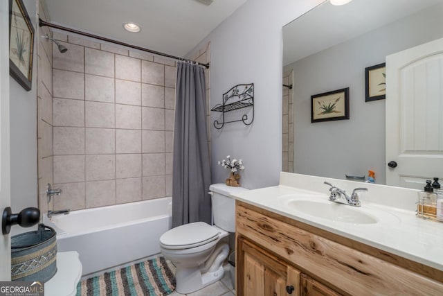 full bathroom featuring tile patterned flooring, vanity, toilet, and shower / bath combo with shower curtain