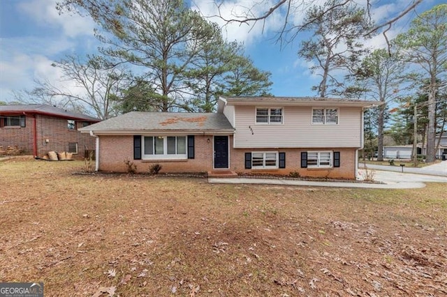 split level home with a front yard