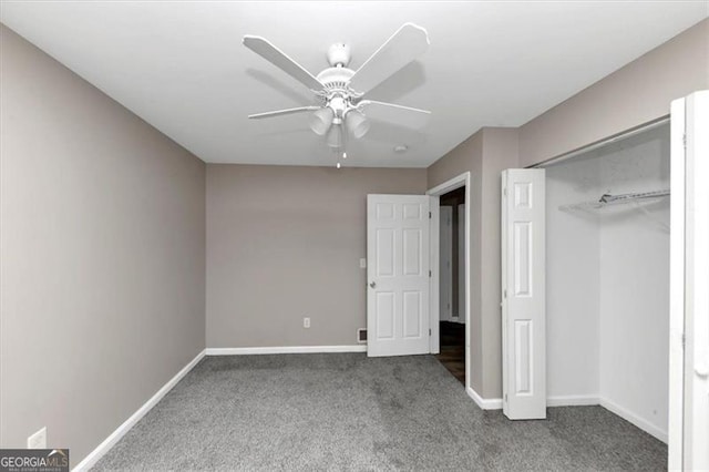 unfurnished bedroom with ceiling fan, a closet, and carpet