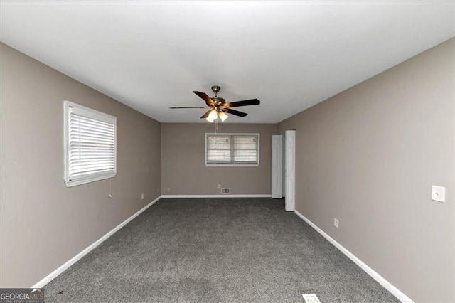 carpeted empty room with ceiling fan