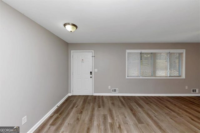 foyer with light hardwood / wood-style floors