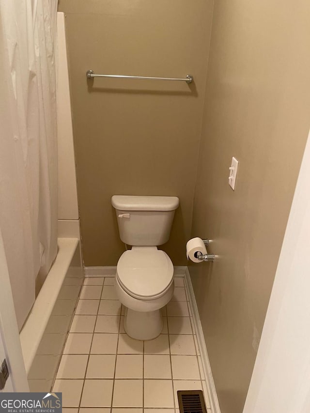 bathroom featuring tile patterned floors and toilet