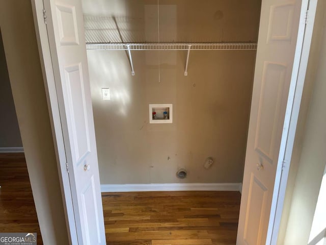 laundry area featuring hookup for an electric dryer, hookup for a washing machine, and dark hardwood / wood-style floors