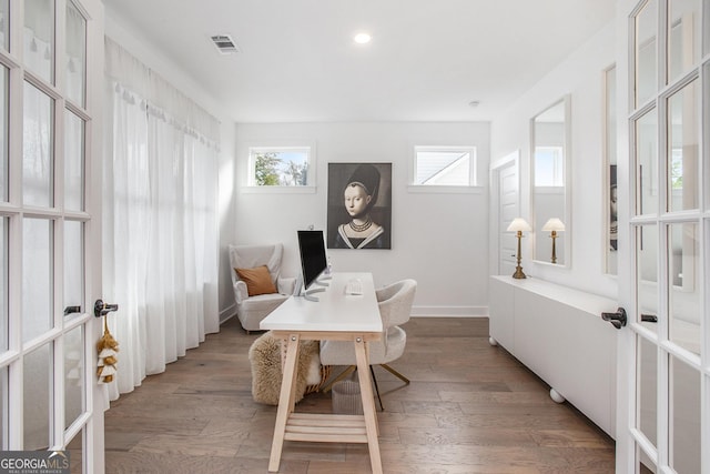 home office featuring french doors and wood-type flooring