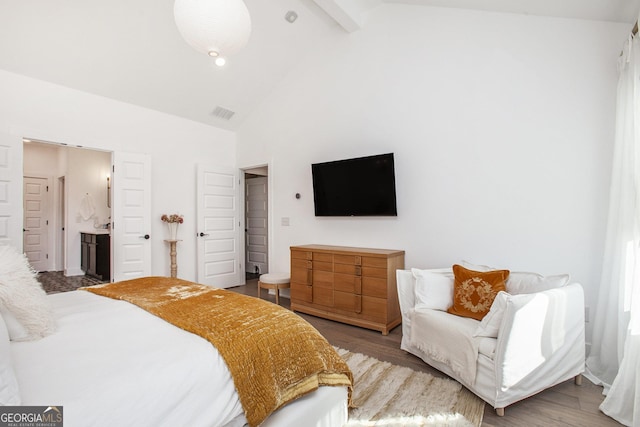 bedroom featuring wood-type flooring, connected bathroom, high vaulted ceiling, and beamed ceiling