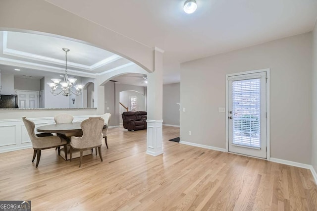 dining room featuring light hardwood / wood-style floors and a notable chandelier