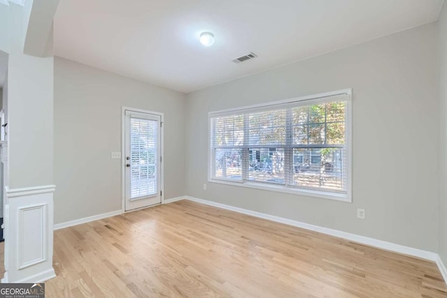 spare room with light hardwood / wood-style floors