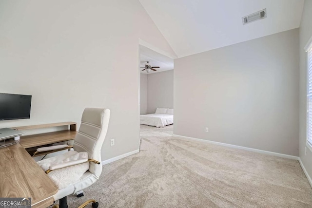 carpeted office space featuring ceiling fan and lofted ceiling