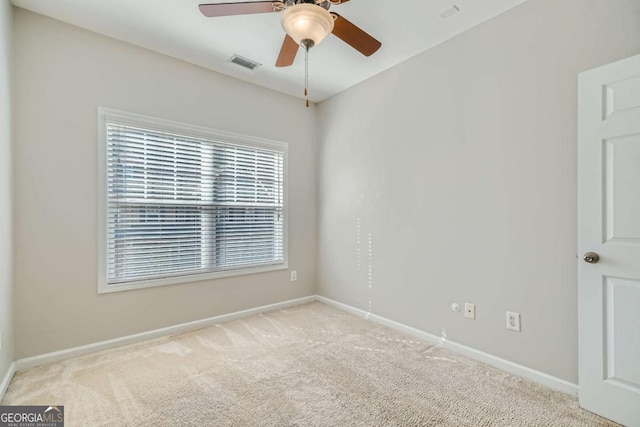 carpeted empty room with ceiling fan