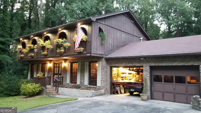 view of front of property featuring a porch and a garage