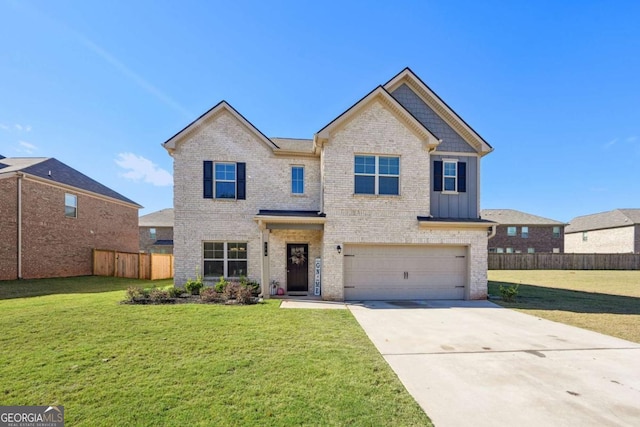 view of front of house with a garage and a front lawn