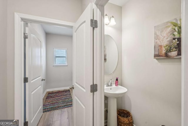 bathroom with wood-type flooring