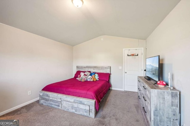 bedroom featuring carpet and vaulted ceiling