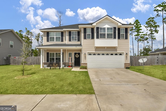 view of front of property with a garage and a front lawn