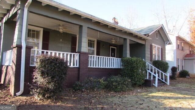 view of property exterior featuring covered porch