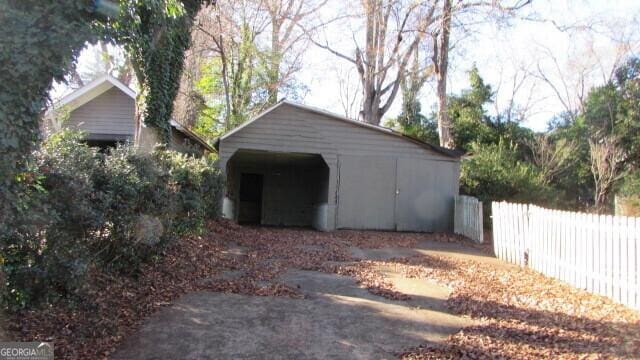 garage featuring a carport