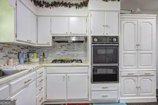 kitchen with backsplash, extractor fan, black double oven, white cabinetry, and stainless steel gas cooktop