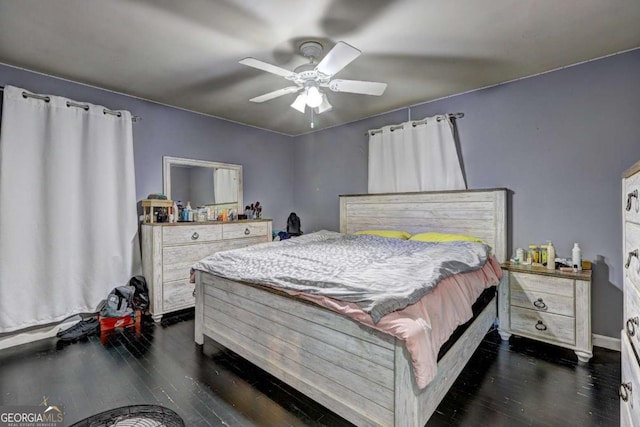 bedroom with ceiling fan and dark wood-type flooring