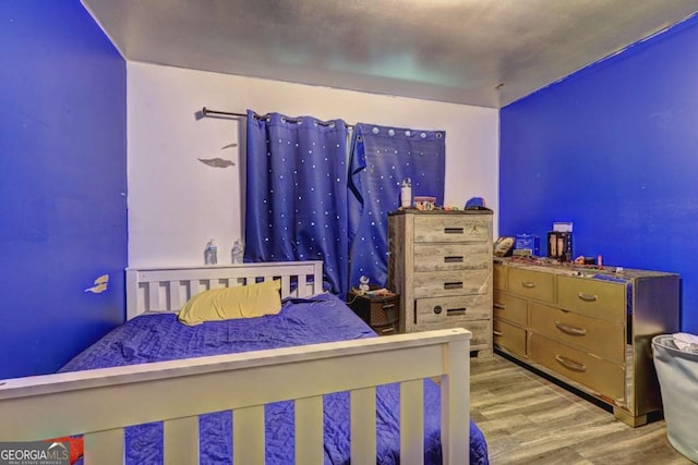 bedroom featuring light hardwood / wood-style floors