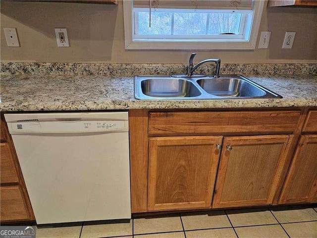 kitchen with dishwasher, light tile patterned flooring, and sink