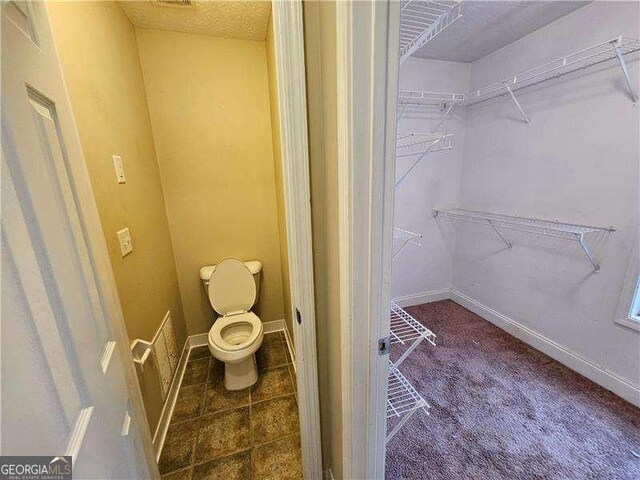 bathroom featuring toilet