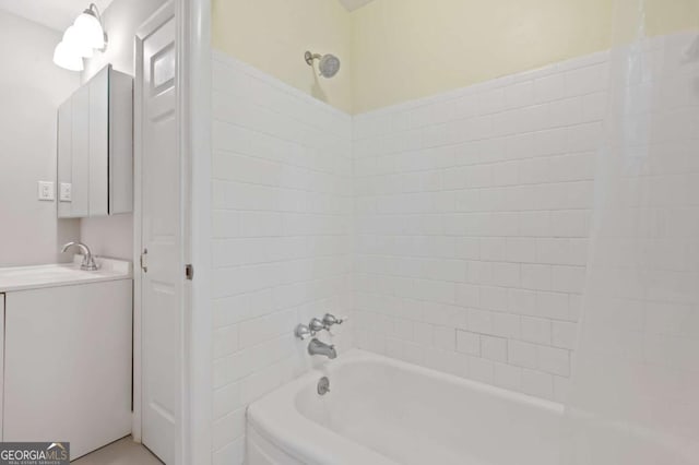 bathroom featuring shower / tub combination and vanity