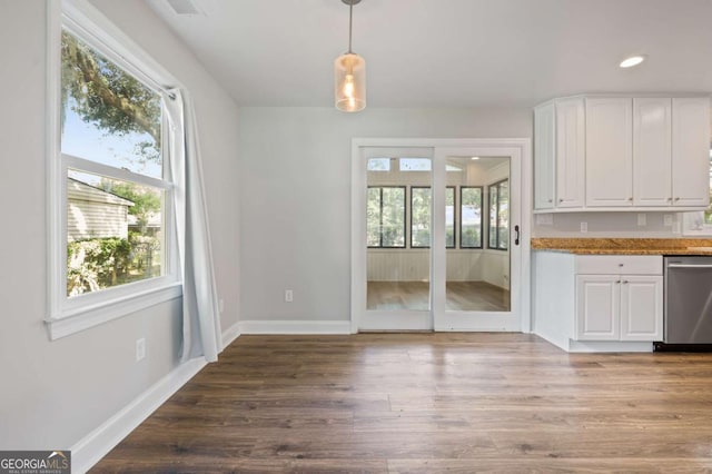 unfurnished dining area with hardwood / wood-style flooring