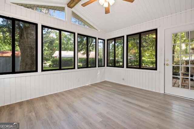 unfurnished sunroom featuring ceiling fan and lofted ceiling with beams