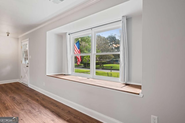 unfurnished room with dark hardwood / wood-style floors and ornamental molding