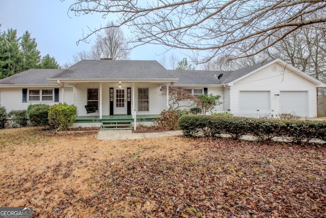 ranch-style house with covered porch and a garage