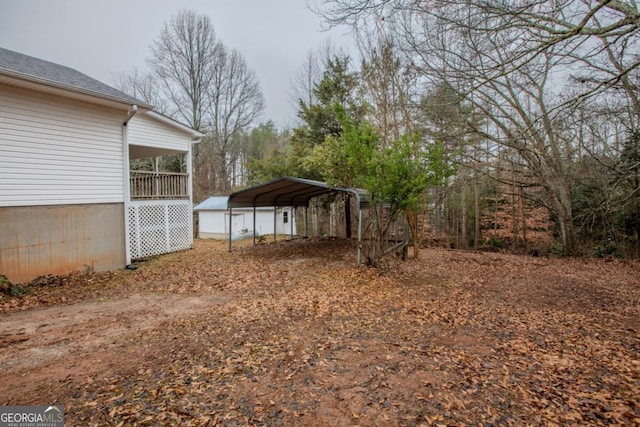 view of yard with a carport