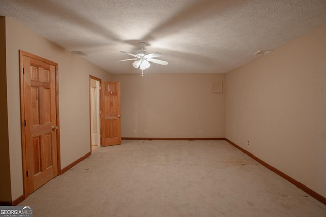 interior space with ceiling fan and a textured ceiling