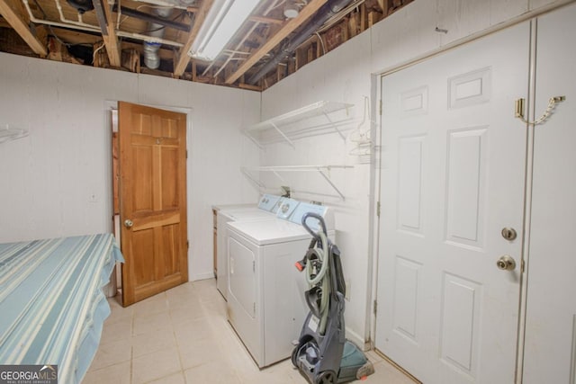 laundry area featuring washing machine and clothes dryer