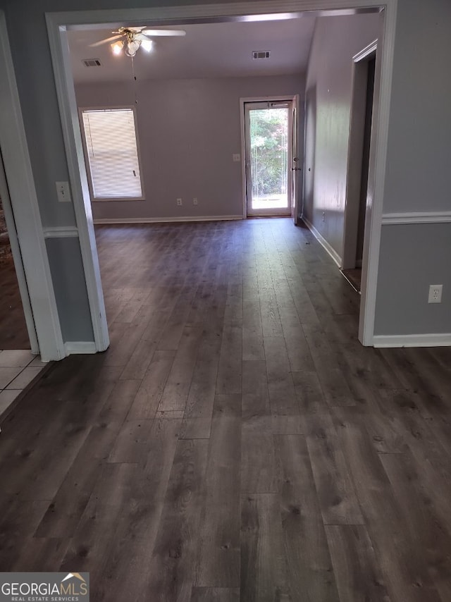 interior space featuring ceiling fan and dark hardwood / wood-style floors