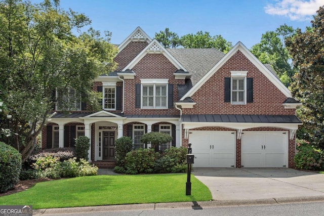 view of front facade with a front lawn and a garage