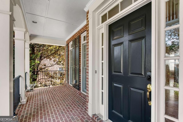 entrance to property featuring a porch