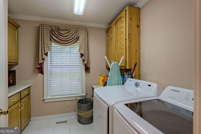 washroom with cabinets, independent washer and dryer, and ornamental molding