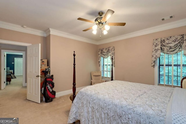 carpeted bedroom featuring ceiling fan and crown molding